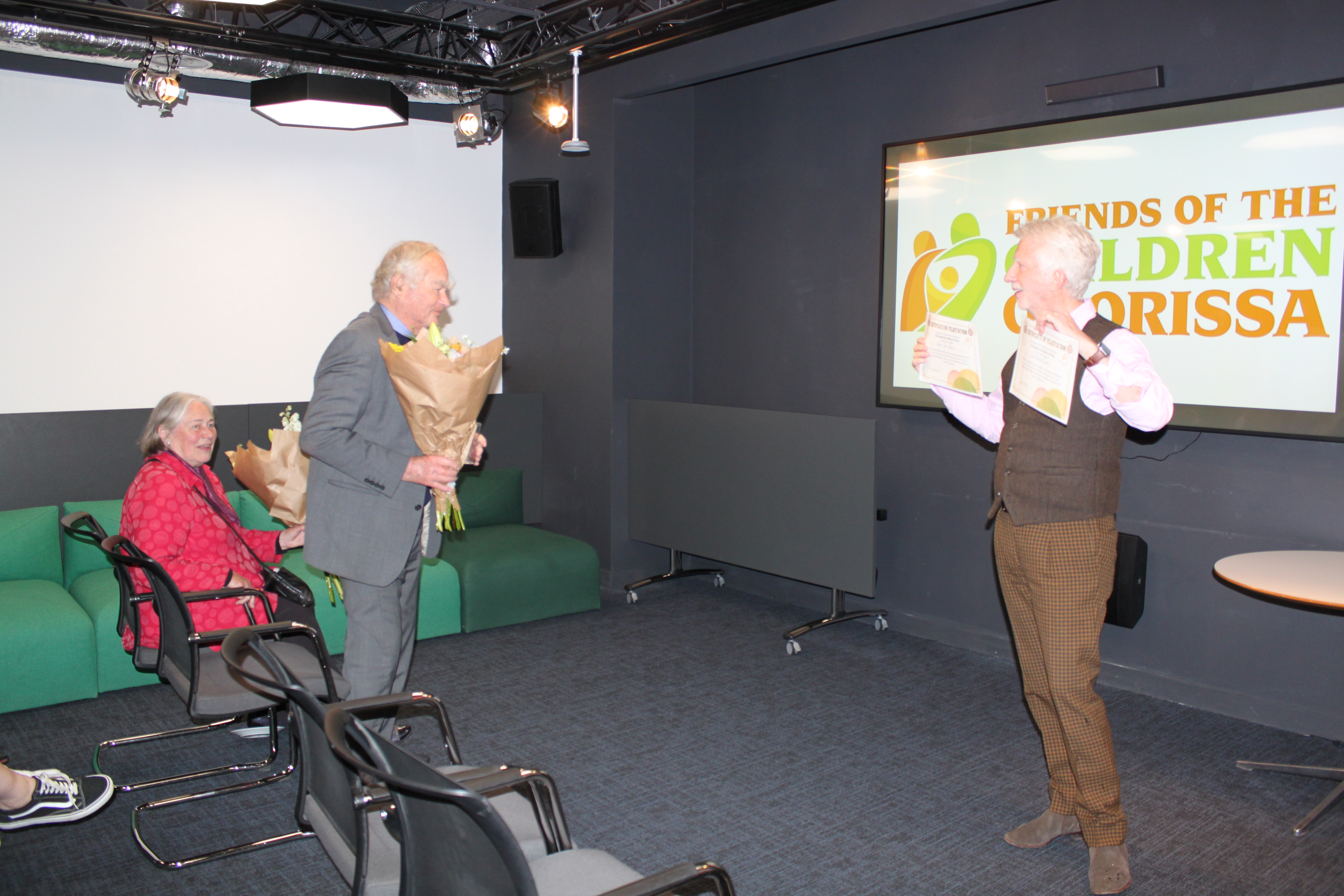 Jimmy presenting Malcolm with certificates